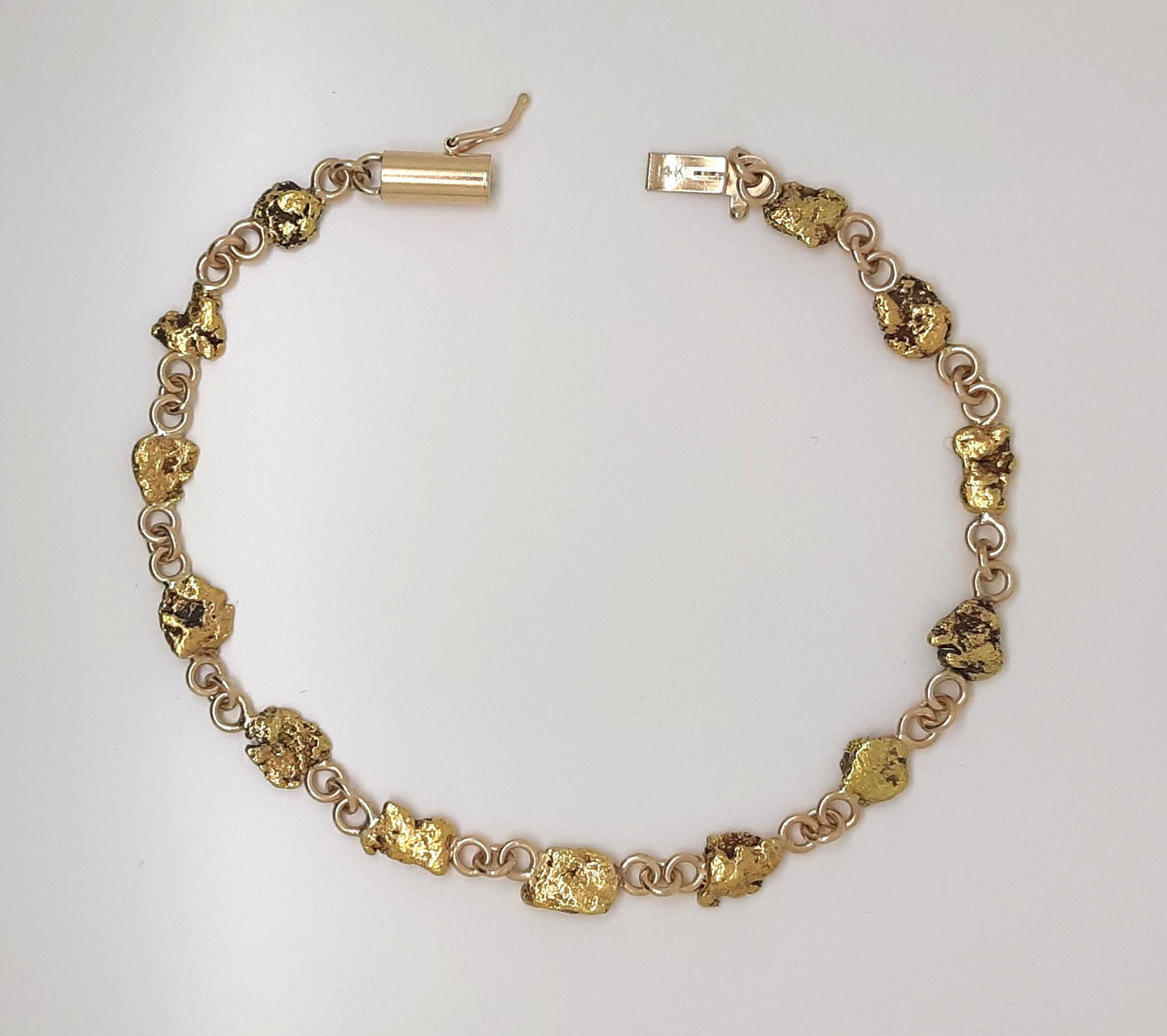 A Lady’s estate 14k yellow gold line bracelet set with genuine Montana placer gold nuggets. C 1980s