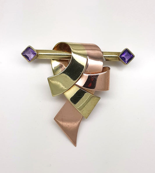 A lady's vintage Retro period 14k green and rose gold ribbon and bar brooch with square baguette cut natural amethyst accents.
