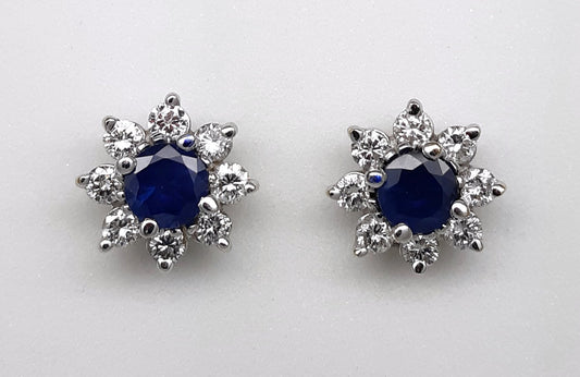 A lady’s estate 14k white gold natural blue sapphire and diamond earrings.