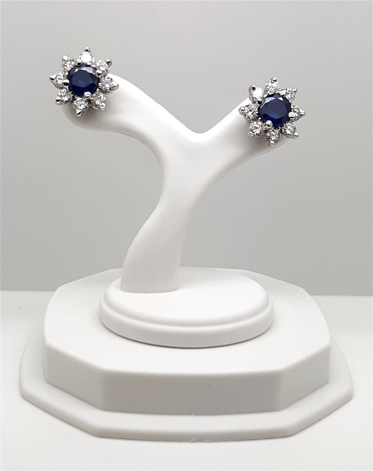 A lady’s estate 14k white gold natural blue sapphire and diamond earrings.