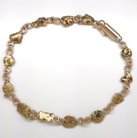 A Lady’s estate 14k yellow gold line bracelet set with genuine Montana placer gold nuggets. C 1980s