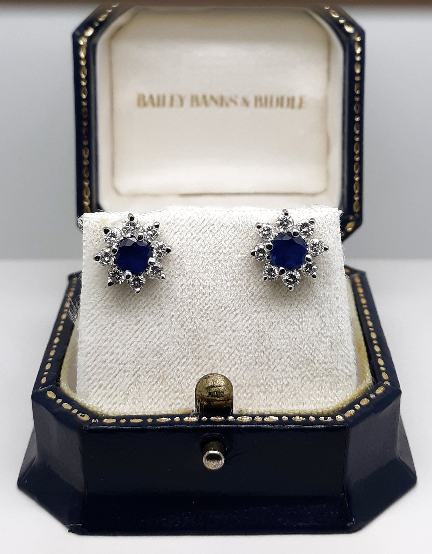A lady’s estate 14k white gold natural blue sapphire and diamond earrings.