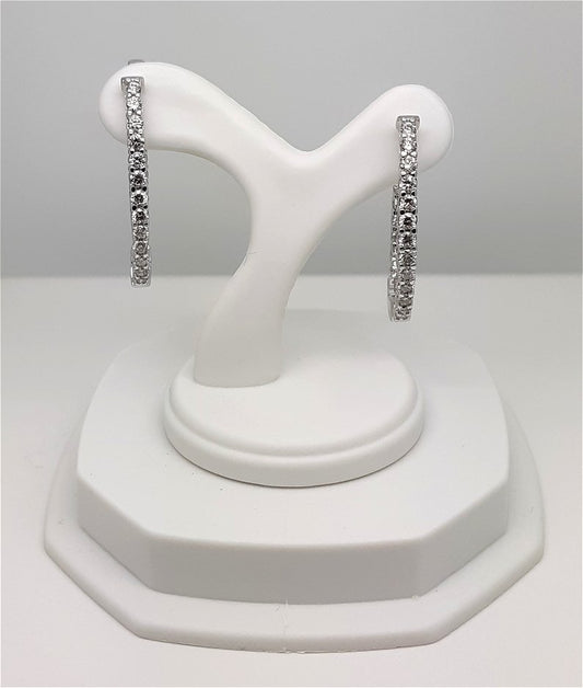 A Lady’s estate pair of 14k white gold “inside – outside” diamond hoop earrings with an approximate total diamond weight of 1.00 carat.