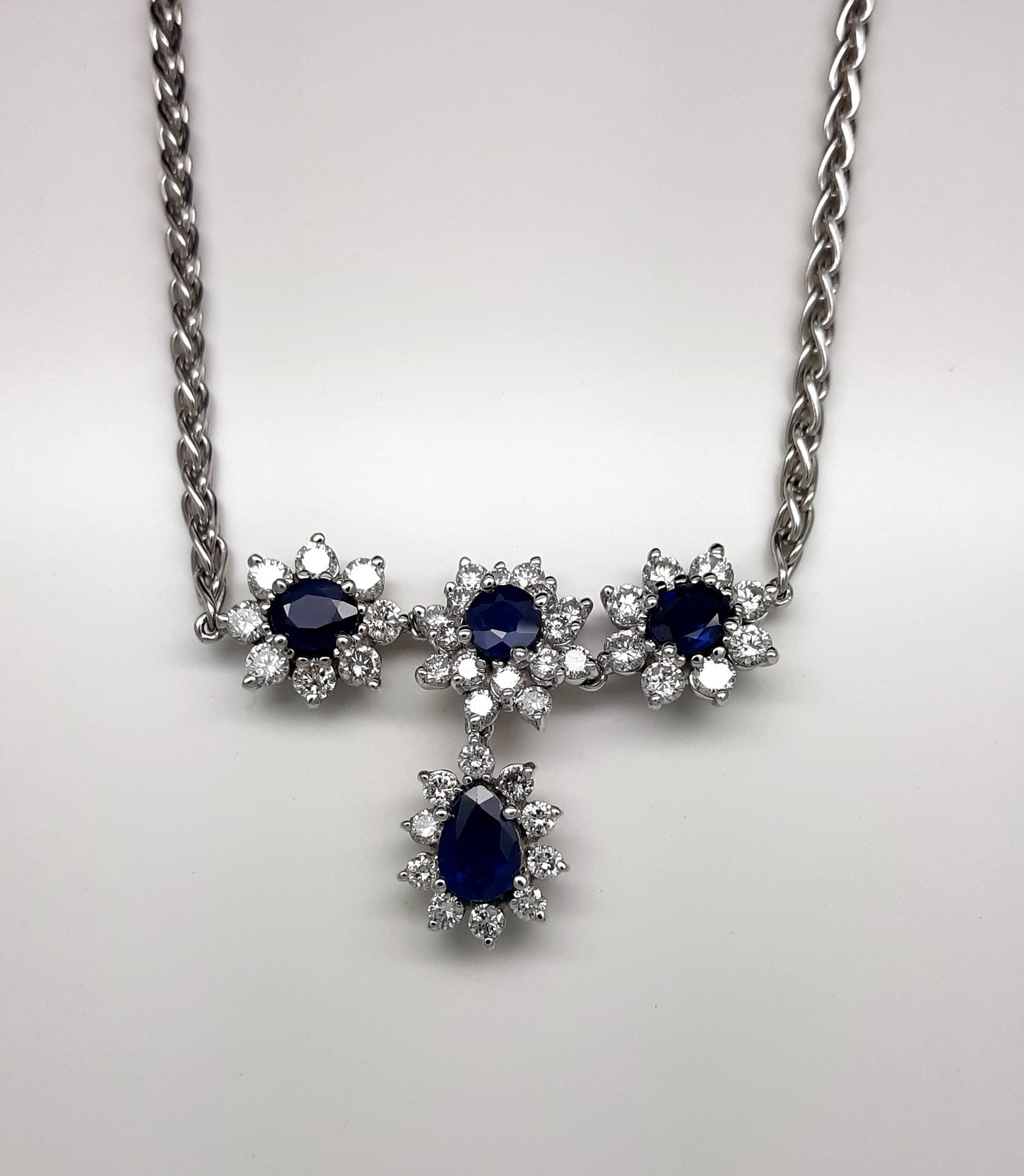 A Lady’s fine estate 14k white gold sapphire and diamond necklace.  Circa 1990s