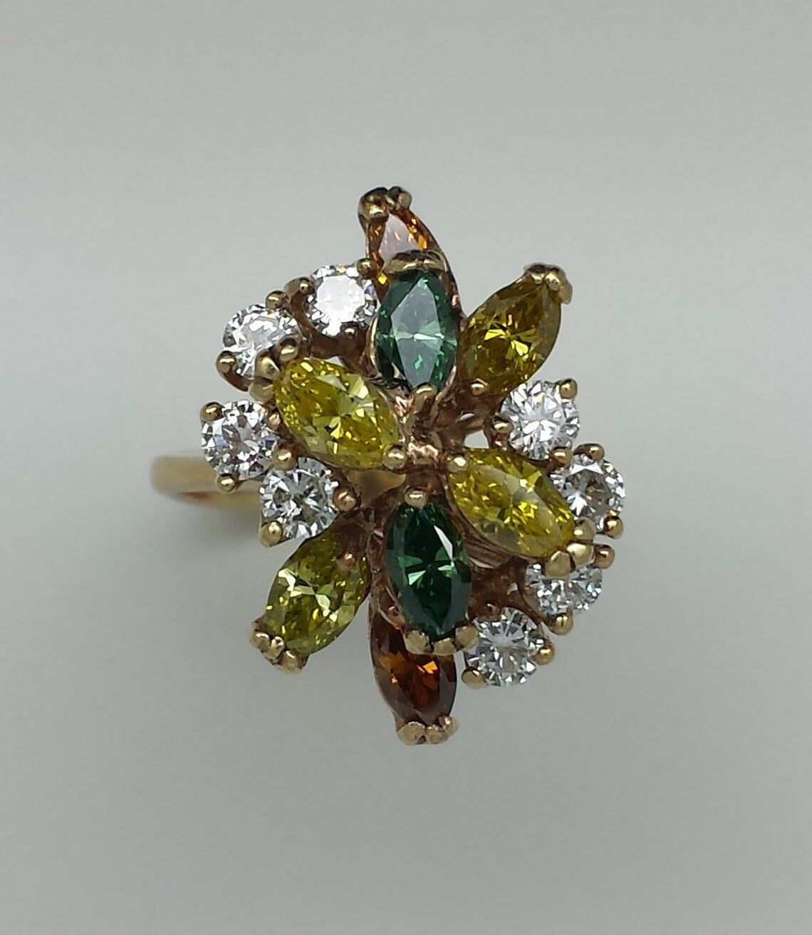 A lady's estate 14k yellow gold fruit salad fancy color diamond dinner ring. c 1970s